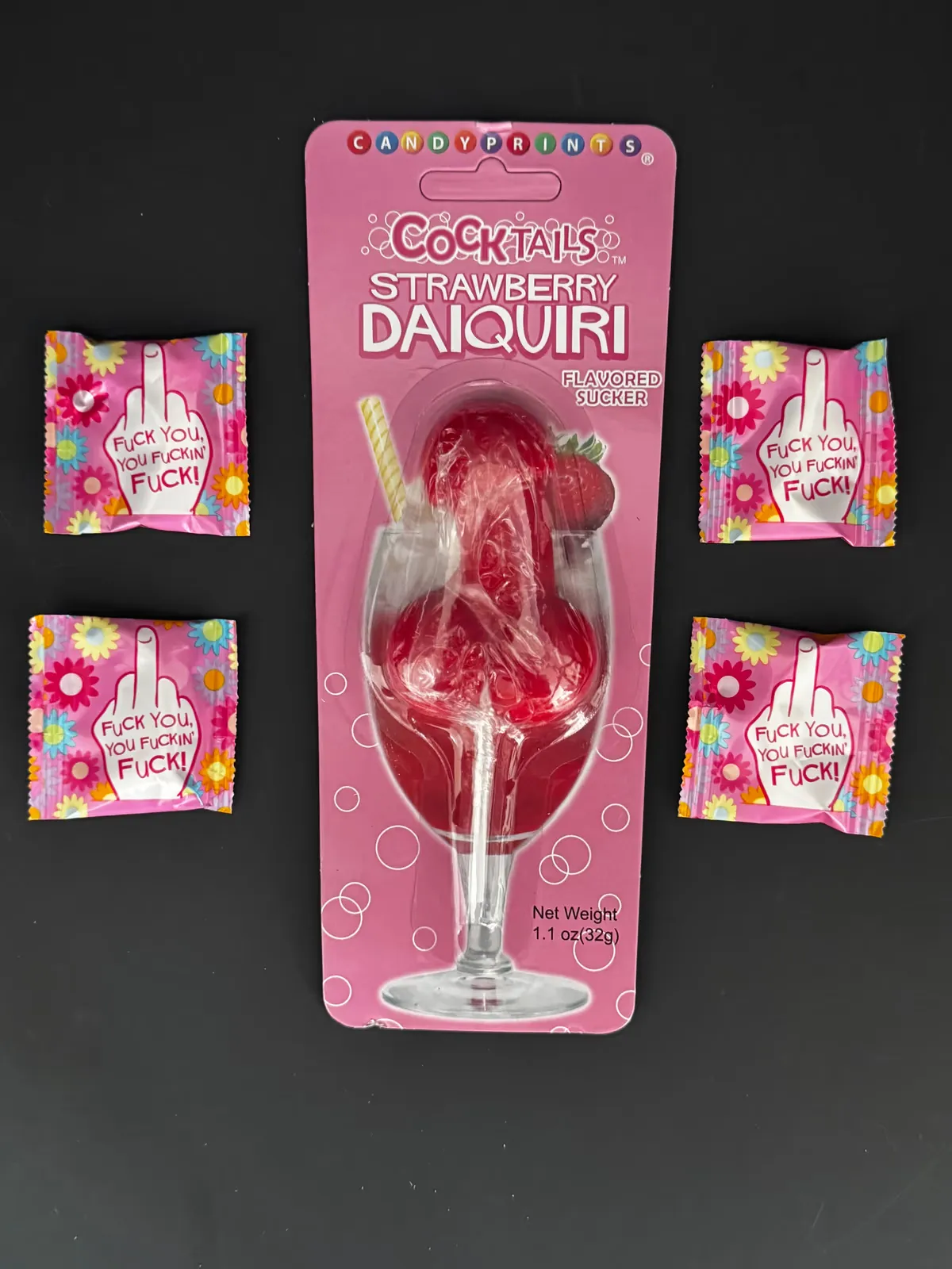 Strawberry daiquiri lollipop with novelty candy packs around it