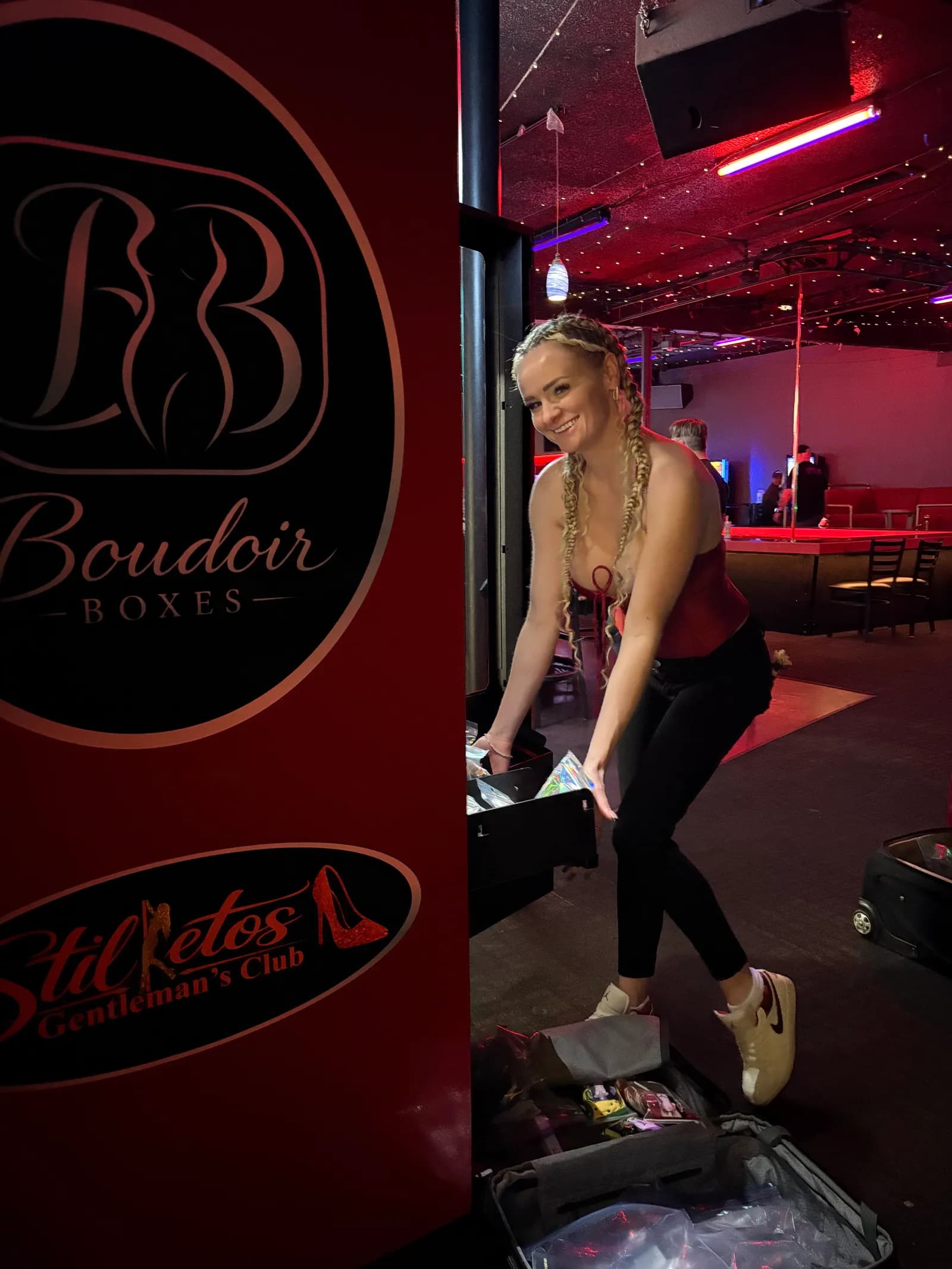 Restocking a Boudoir Boxes machine on the floor at Stilettos Gentleman's Club in Portland